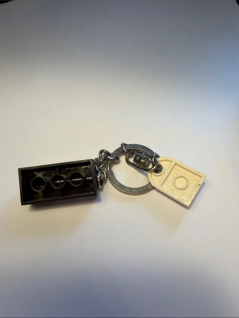 Lego Black Brick Keychain with White and Red Logo Tag